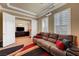 Comfortable media room features large plush sofa and projector for a cinematic viewing experience at 2913 Grande Arch St, Henderson, NV 89044