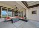 Entertain on the patio with built in seating, outdoor fireplace, covered pergola, and mountain views at 2913 Grande Arch St, Henderson, NV 89044