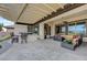 Outdoor patio area with a built-in grill, seating, and a covered pergola, perfect for al fresco dining at 2913 Grande Arch St, Henderson, NV 89044