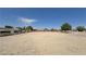 Large, empty backyard showing the potential for landscaping and recreational activities at 3110 National Ave, Pahrump, NV 89048