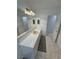 Bright bathroom with white tiled counter, decorative cabinets, and a large mirror at 3110 National Ave, Pahrump, NV 89048