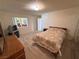 Bedroom featuring a queen-sized bed and sliding mirror closet at 3110 National Ave, Pahrump, NV 89048