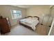 Bedroom featuring a queen-sized bed, a window with natural light, and a mirrored closet at 3110 National Ave, Pahrump, NV 89048