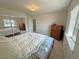Bedroom with a view of a large mirrored closet, a dresser, and a window providing natural light at 3110 National Ave, Pahrump, NV 89048