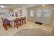 Open dining area with a large kitchen island, bar stools, and a view of the front door at 3110 National Ave, Pahrump, NV 89048