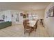 Bright dining room with large table, natural light, and access to the living area at 3110 National Ave, Pahrump, NV 89048