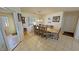 Dining area with large table and seating, with views of the backyard through the window at 3110 National Ave, Pahrump, NV 89048