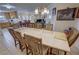 Open dining room with large table and chairs, connected to the kitchen and living areas at 3110 National Ave, Pahrump, NV 89048