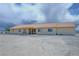 The back exterior features a covered patio with a table and grill at 3110 National Ave, Pahrump, NV 89048