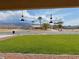 Charming single-story home with a well-manicured lawn, and desert landscaping at 3110 National Ave, Pahrump, NV 89048
