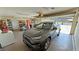Well-organized garage interior featuring a gray SUV, shelving, and ample storage space at 3110 National Ave, Pahrump, NV 89048