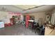Spacious garage interior with a half bath, storage shelves, and various household items at 3110 National Ave, Pahrump, NV 89048