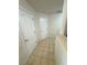 Hallway featuring tiled floors and two interior doors at 3110 National Ave, Pahrump, NV 89048