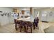 Spacious kitchen with island seating, white appliances, and open layout to dining area at 3110 National Ave, Pahrump, NV 89048
