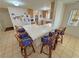 Open kitchen with large tiled island and seating for eight, perfect for Gathering gatherings at 3110 National Ave, Pahrump, NV 89048