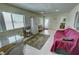 Bright sun room boasts tile floors and seamless connection to the outdoors at 3110 National Ave, Pahrump, NV 89048