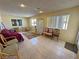 The sun room features tile floors and natural light, and is perfect for relaxation or entertaining at 3110 National Ave, Pahrump, NV 89048