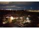 Stunning aerial view of the home at night, highlighting the manicured landscaping and serene setting at 3240 W Richmar Ave, Las Vegas, NV 89139