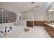 Luxurious bathroom with a soaking tub, elegant fixtures, and modern design for a spa-like experience at 3240 W Richmar Ave, Las Vegas, NV 89139
