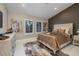 Comfortable bedroom with a decorative bed frame, neutral color palette, and ample natural light at 3240 W Richmar Ave, Las Vegas, NV 89139