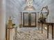 Welcoming home foyer with elegant chandelier, double doors, and stylish decor for a grand entrance at 3240 W Richmar Ave, Las Vegas, NV 89139