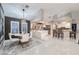 Open concept kitchen with a dining area, bar-style seating, and marble countertops at 3240 W Richmar Ave, Las Vegas, NV 89139