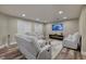 Bright living room features comfortable seating, a modern fireplace, and plenty of natural light from the windows at 3240 W Richmar Ave, Las Vegas, NV 89139