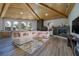 Spacious living room features vaulted wood ceilings, modern fireplace, and abundant natural light through large windows at 3240 W Richmar Ave, Las Vegas, NV 89139