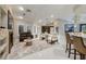 Bright, open living space with a fireplace, cozy seating, and seamless flow to the kitchen and dining areas at 3240 W Richmar Ave, Las Vegas, NV 89139