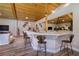 Living room with wood-look flooring, long bar countertop, vaulted ceilings and views to the garden at 3240 W Richmar Ave, Las Vegas, NV 89139