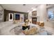 Sophisticated living room featuring a sleek fireplace, chic furniture, and French doors to a patio at 3240 W Richmar Ave, Las Vegas, NV 89139
