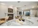 Spacious living area featuring a modern fireplace, stylish seating, and elegant decor elements at 3240 W Richmar Ave, Las Vegas, NV 89139