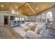 Spacious living room featuring a view to the kitchen bar, comfortable seating, and natural light at 3240 W Richmar Ave, Las Vegas, NV 89139