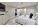 Serene bedroom with a plush bed, modern decor, and ample natural light creates a relaxing retreat at 3240 W Richmar Ave, Las Vegas, NV 89139