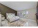 Chic primary bedroom featuring a fireplace, neutral walls, and large windows for plenty of natural light at 3240 W Richmar Ave, Las Vegas, NV 89139
