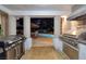 Outdoor kitchen with stainless steel grill and pool in background, creating an ideal spot for entertaining at 3240 W Richmar Ave, Las Vegas, NV 89139