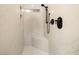 Elegant shower with marble walls, built-in seat and shelving, and a modern shower head at 3240 W Richmar Ave, Las Vegas, NV 89139