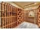 Custom wine cellar features wooden racking and space for storing and displaying a large wine collection at 3240 W Richmar Ave, Las Vegas, NV 89139