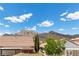 Mountain views from the backyard showcasing the gazebo, patio, and surrounding houses at 3268 Grayson Lake Ct, Las Vegas, NV 89129