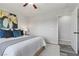 Well decorated bedroom with large painting, ceiling fan, and modern decor at 3268 Grayson Lake Ct, Las Vegas, NV 89129