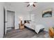 Bright bedroom with a ceiling fan, artwork on the wall, and a large window at 3268 Grayson Lake Ct, Las Vegas, NV 89129