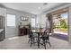 Cozy dining area features a dining table, adjacent to sliding glass door providing outdoor views at 3268 Grayson Lake Ct, Las Vegas, NV 89129