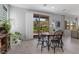 Bright dining area adjacent to a living area and an outdoor space through sliding glass doors at 3268 Grayson Lake Ct, Las Vegas, NV 89129