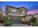 Beautiful two-story home with a two-car garage and desert landscaping at 3268 Grayson Lake Ct, Las Vegas, NV 89129