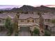 Charming two-story home featuring desert landscaping and a two-car garage at 3268 Grayson Lake Ct, Las Vegas, NV 89129
