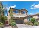 Beautiful two-story home featuring desert landscaping and a two-car garage at 3268 Grayson Lake Ct, Las Vegas, NV 89129