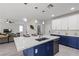 An open kitchen featuring a large island with seating and sink, perfect for entertaining and casual dining at 3268 Grayson Lake Ct, Las Vegas, NV 89129
