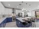 Well-lit kitchen featuring modern appliances, stylish cabinets, and a large central island with barstool seating at 3268 Grayson Lake Ct, Las Vegas, NV 89129