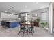 Spacious kitchen featuring large island with seating, stainless steel appliances, and cozy dining area at 3268 Grayson Lake Ct, Las Vegas, NV 89129