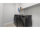 Modern laundry room with stainless steel washer and dryer, with convenient shelving above at 3268 Grayson Lake Ct, Las Vegas, NV 89129